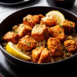 air fryer blackened salmon bites are cooked until tender and flaky served over brown rice