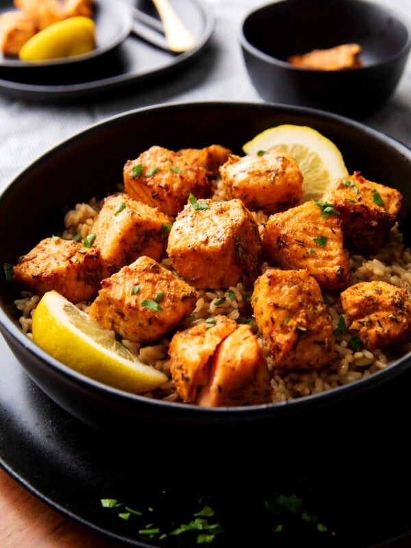 air fryer blackened salmon bites are cooked until tender and flaky served over brown rice