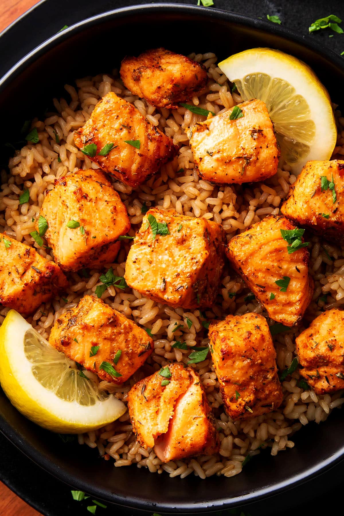 Close up of air fryer blackened salmon bites to show the tender, flaky texture.