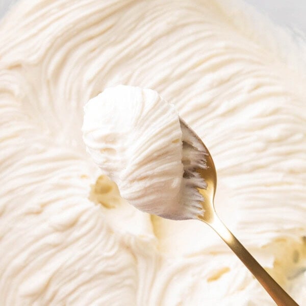 A spoon of thick rich and creamy Cream Cheese Frosting