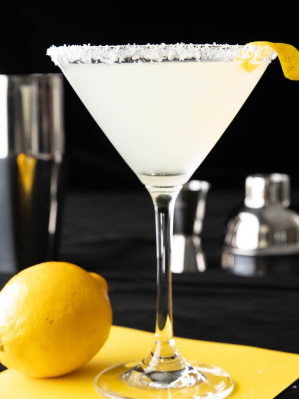 The best lemon drop martini recipe served in a martini glass with a lemon sugar rim and a lemon twist.