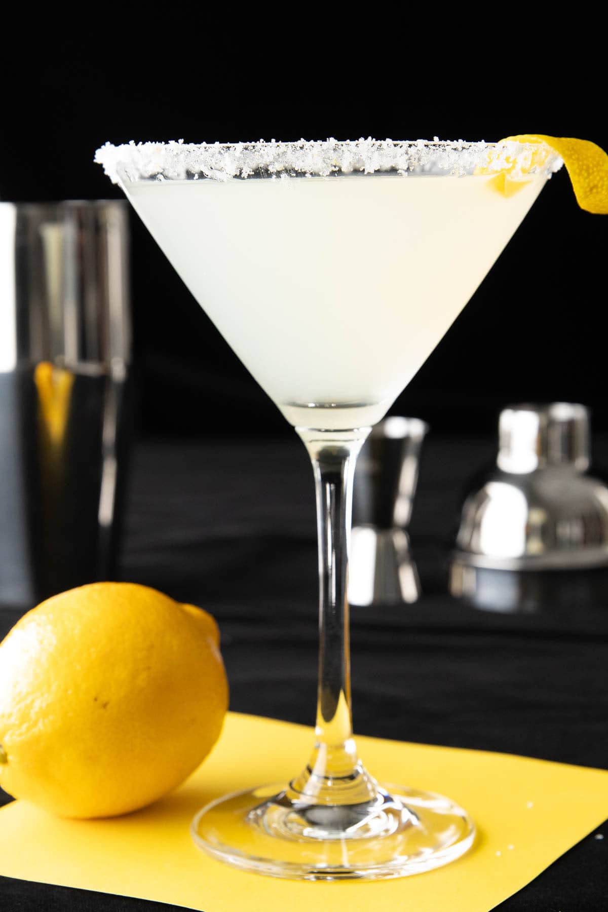 The best lemon drop martini recipe served in a martini glass with a lemon sugar rim and a lemon twist.