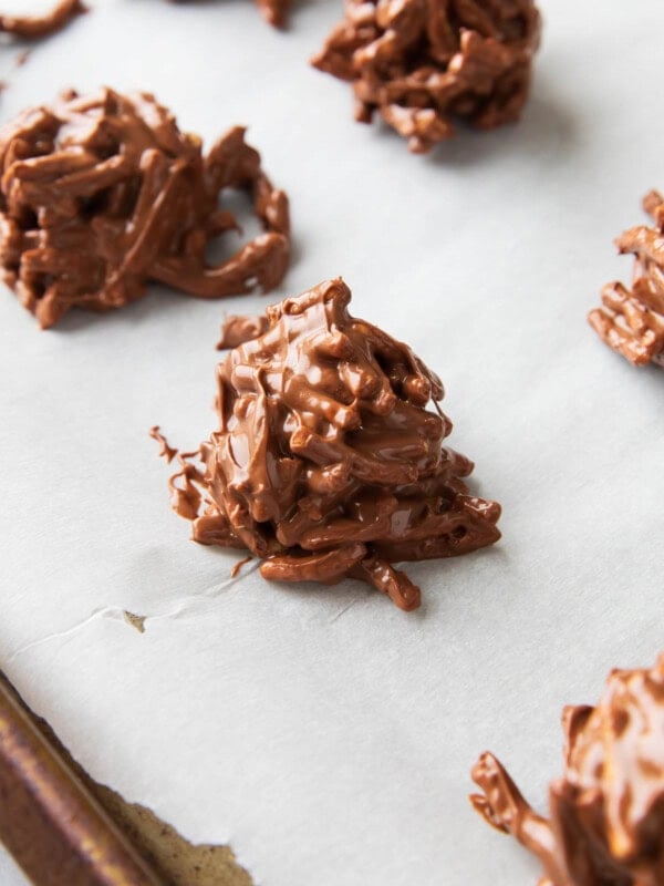 Close up of haystack cookies to show chocolate butterscotch mixture coating crunchy chow mien noodles.