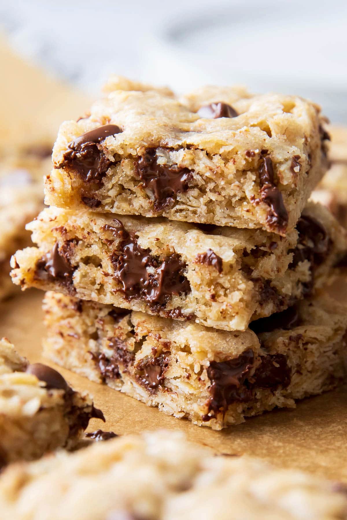 Close up of Oatmeal Cookie Bars in a stack with melted chocolate chips dripping