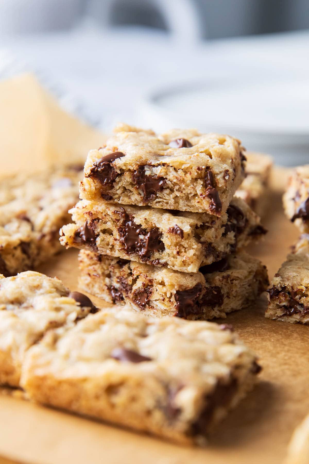 Chewy, moist and crisp oatmeal cookie bars with your favorite add-ins on parchment paper.