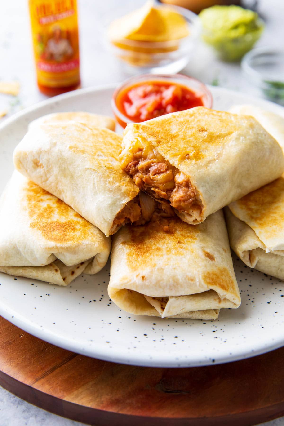 Stacks of this easy Mexican recipe served with golden brown tortillas, seasoned refried beans, and melted cheese.