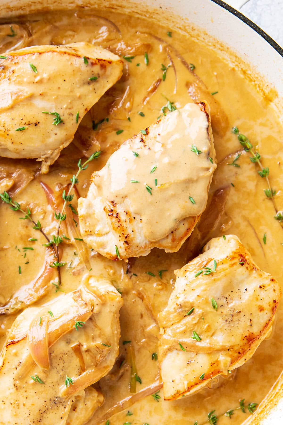 Chicken dijon coated in creamy, tangy dijon mustard sauce with caramelized shallots and fresh thyme.