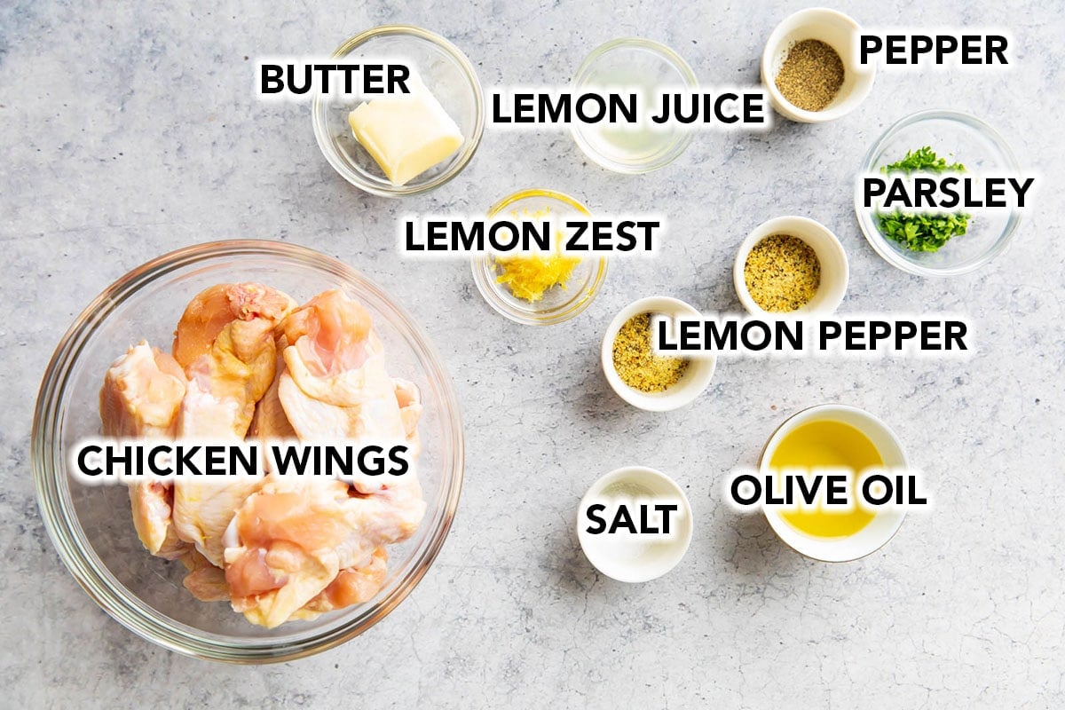 Lemon pepper wings recipe ingredients including chicken wings, butter, lemon zest, lemon juice, lemon pepper, salt and pepper, parsley, oil