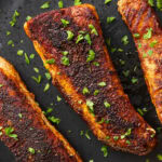 Close up of Blackened Salmon to show perfectly crisped cajun seasoning crust on tender salmon