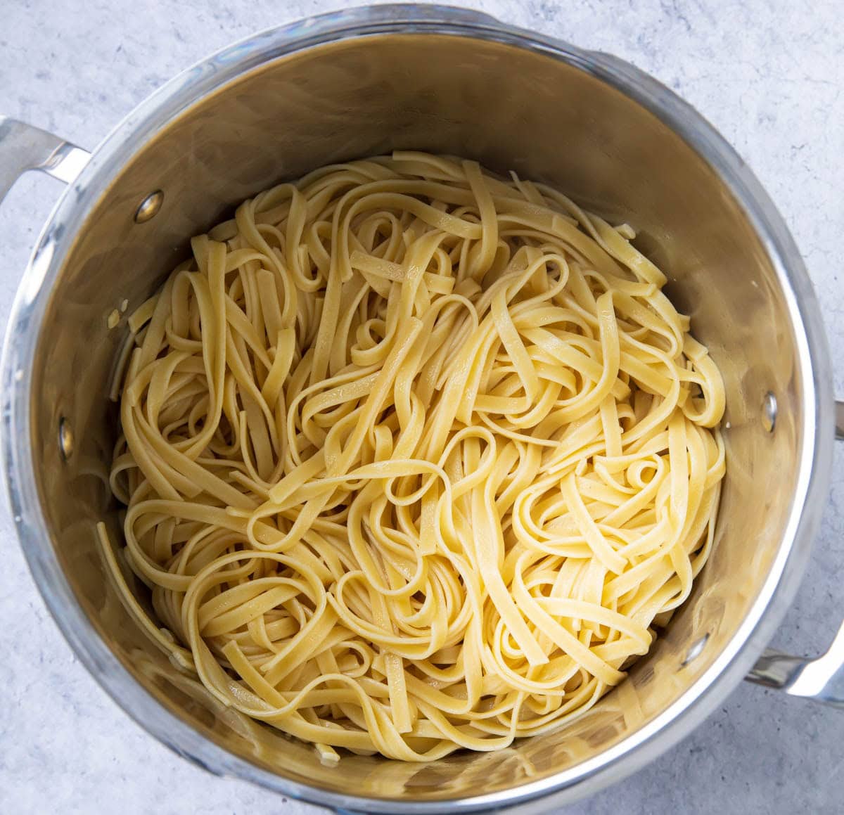 Cooked fettuccine pasta in a pasta pot