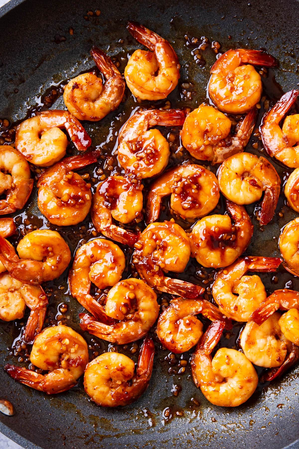 Garlic Asian shrimp cooked in a skillet packed with flavorful, better than takeout sauce.