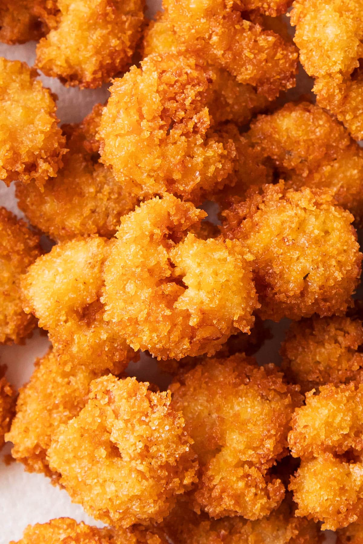 Close up of this popcorn shrimp recipe to show the golden, crispy breading.