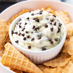 Cannoli Dip served in a bowl with waffle cone pieces