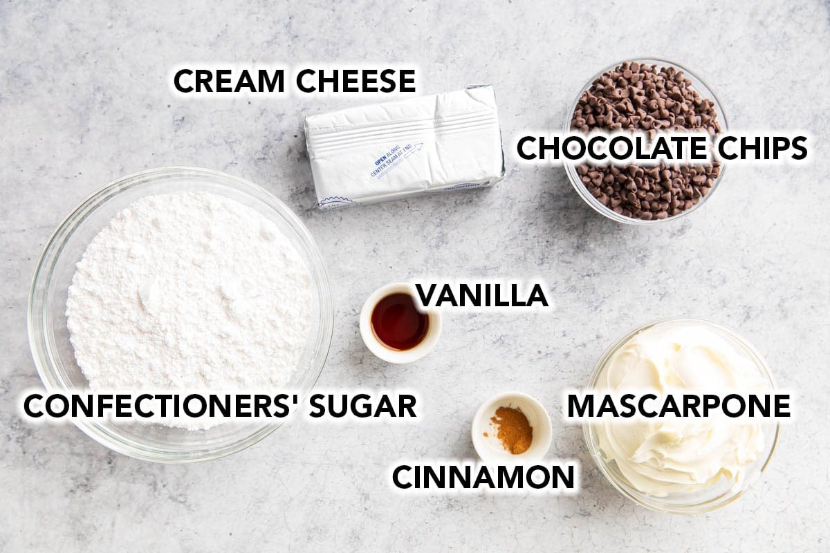 Cannoli Dip ingredients - cream cheese, chocolate chips, mascarpone, cinnamon, and vanilla extract.