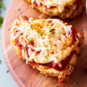 close up of air fryer chicken parmesan with melty mozzarella and loads of marinara on top