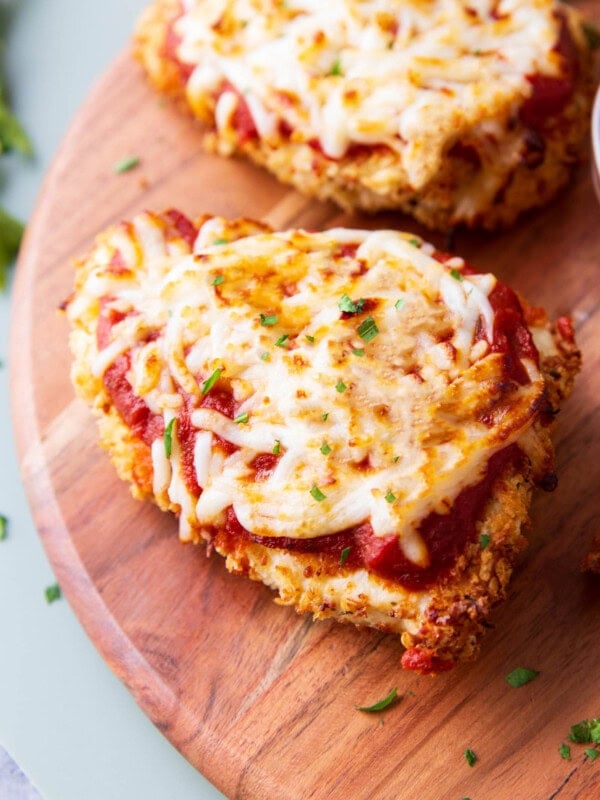 close up of air fryer chicken parmesan with melty mozzarella and loads of marinara on top