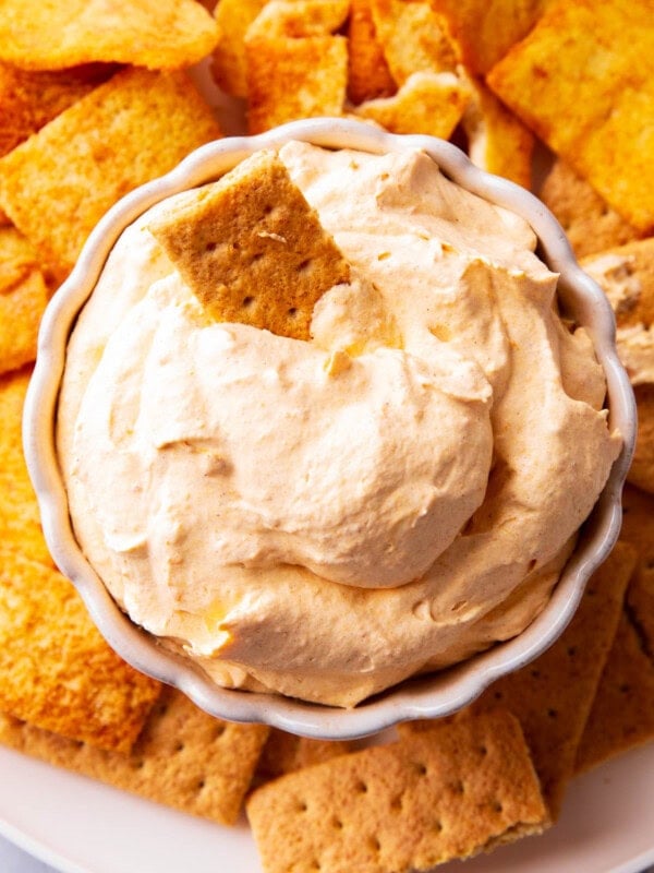 No bake pumpkin fluff with Cool Whip served in a bowl for easy dipping