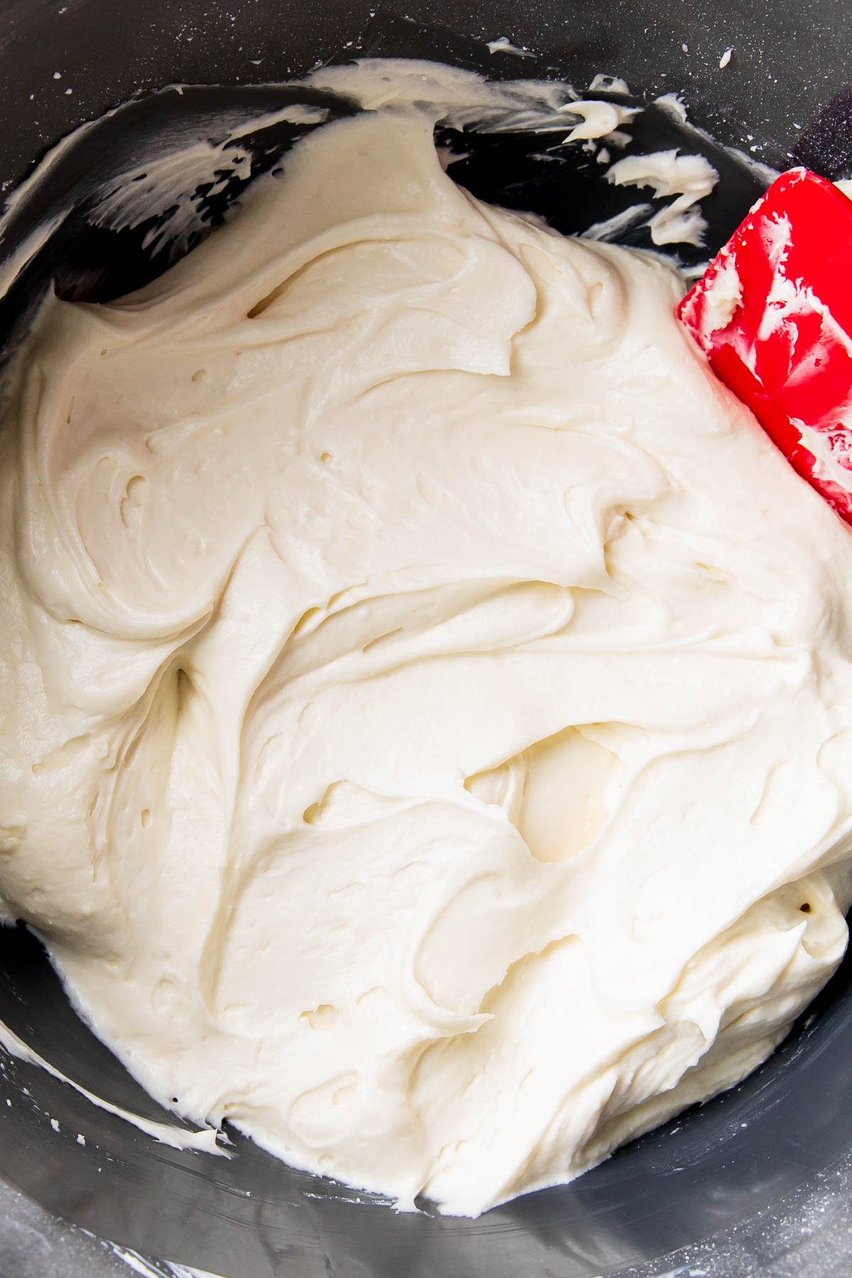Making the cream cheese frosting for pumpkin cupcakes