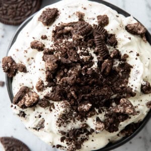 Close up of thick and creamy Oreo Fluff served in a bowl with crushed cookies on top