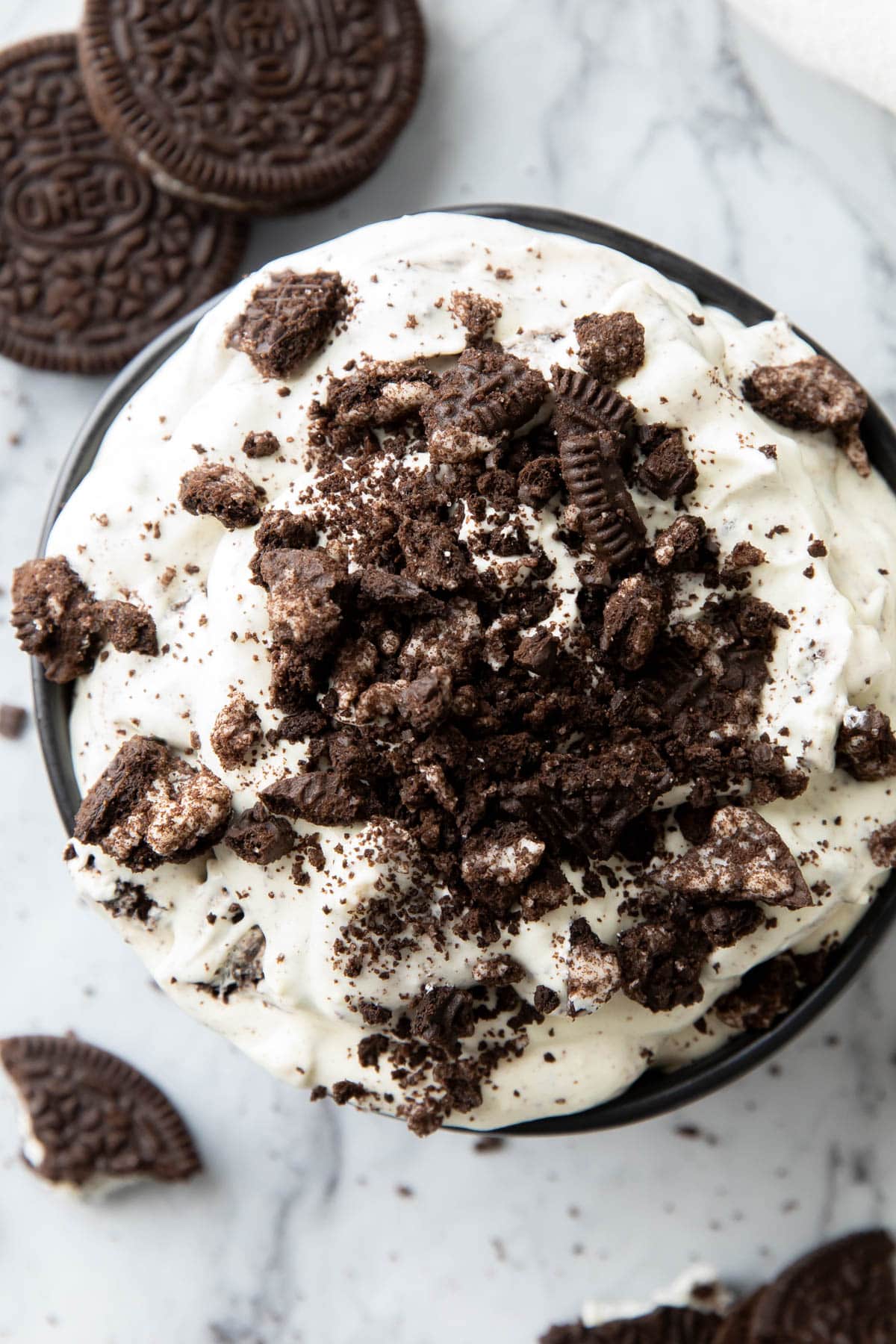 Close up of thick and creamy Oreo Fluff served in a bowl with crushed cookies on top