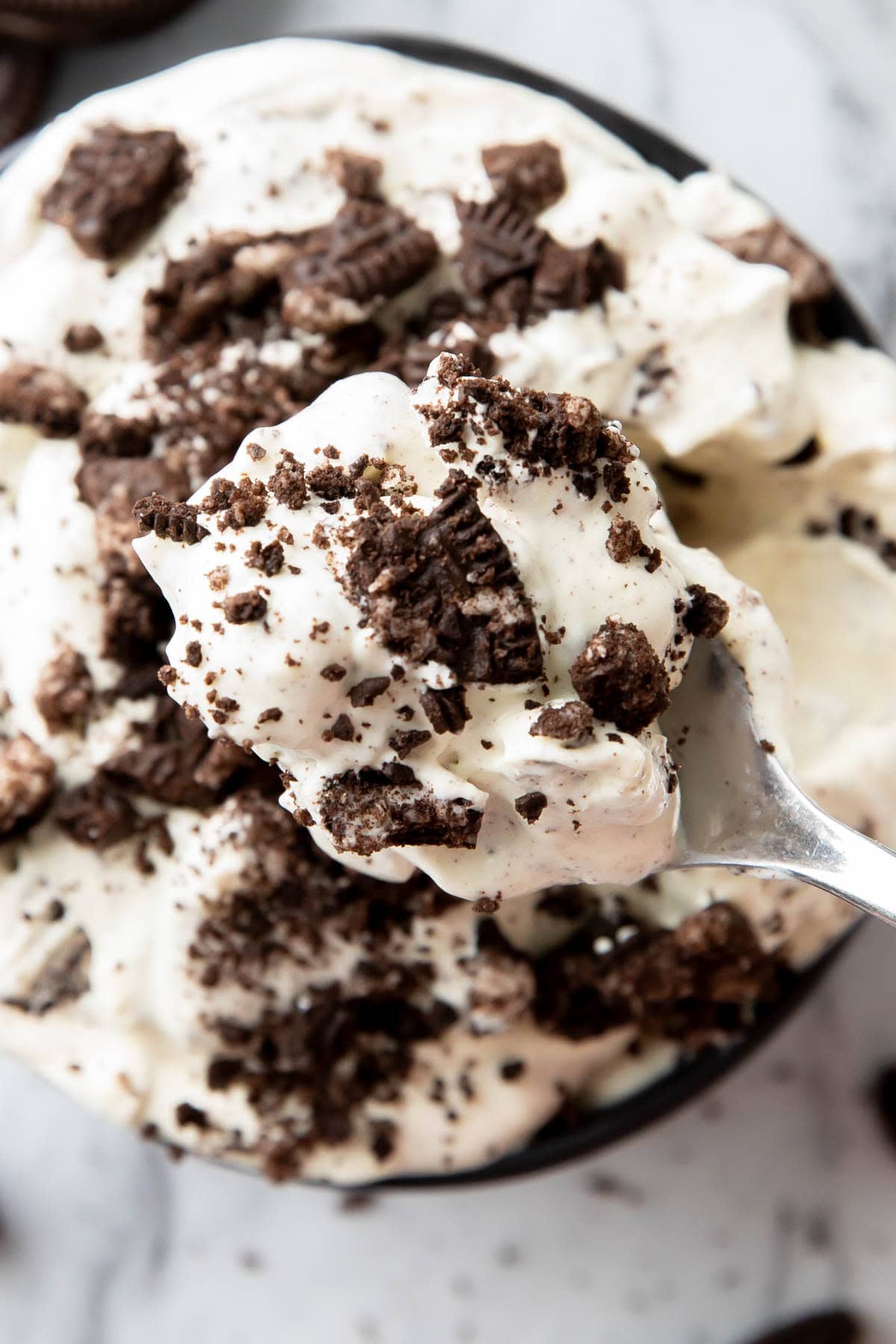 Close up of a spoonful of this easy Oreo Fluff recipe.