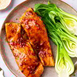 This Asian Salmon recipe is tender and flaky with a homemade sauce that glazes the salmon during cooking