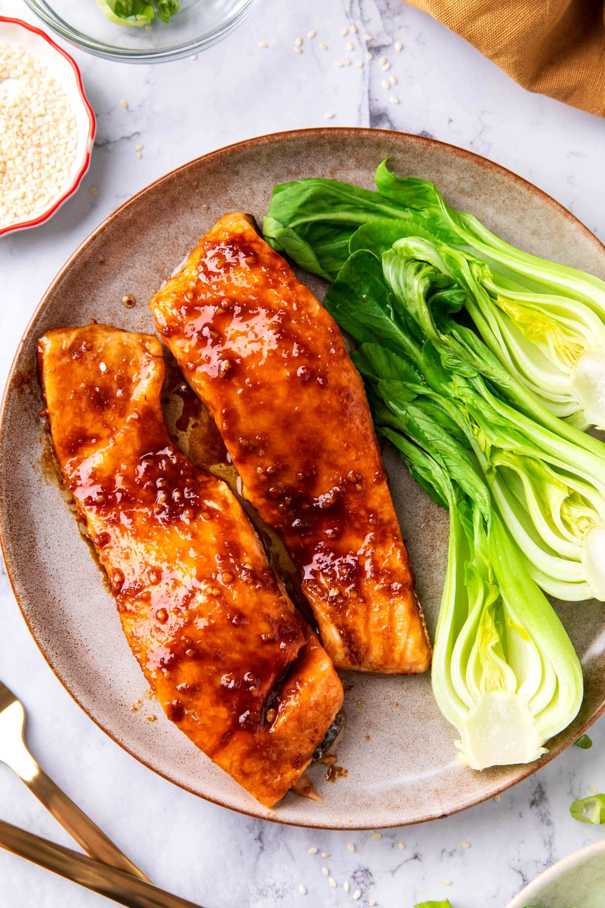 This Asian Salmon recipe is tender and flaky with a homemade sauce that glazes the salmon during cooking.