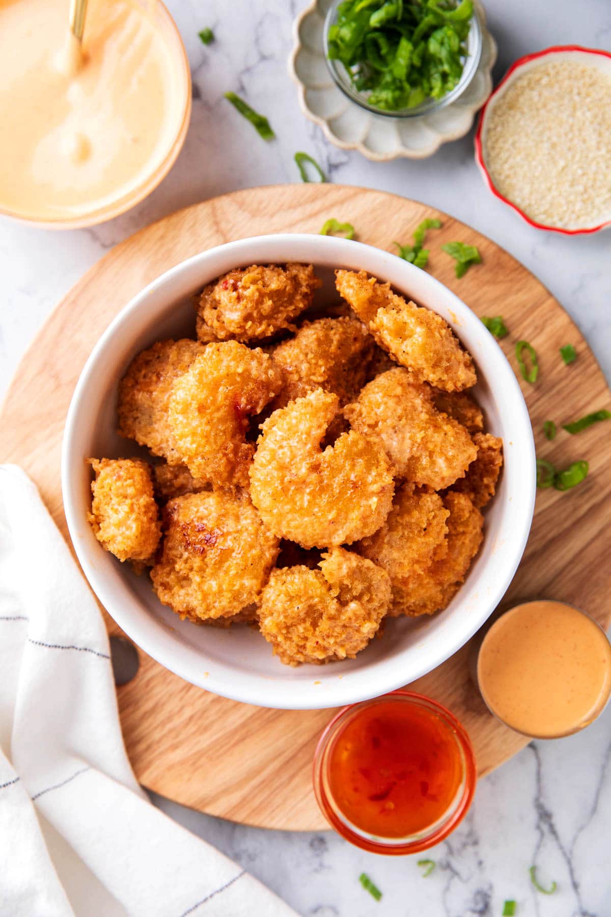 Easy bang bang shrimp with fried breaded coating and juicy shrimp tossed in creamy bang bang sauce.