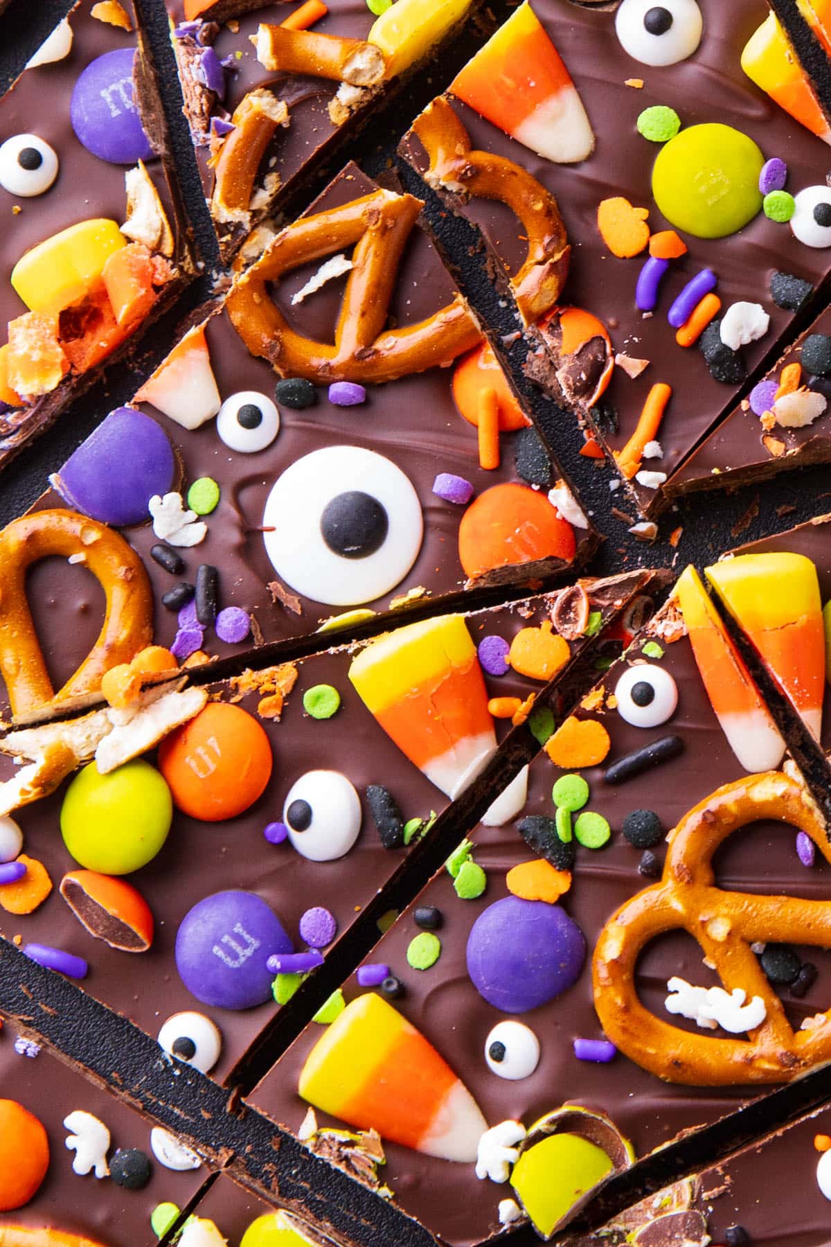 Close up of this Halloween bark recipe candy with googly eyes, pretzels, and more toppings