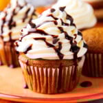 pumpkin chocolate chip cupcakes are moist and topped with cream cheese frosting with chocolate chips and chocolate drizzle