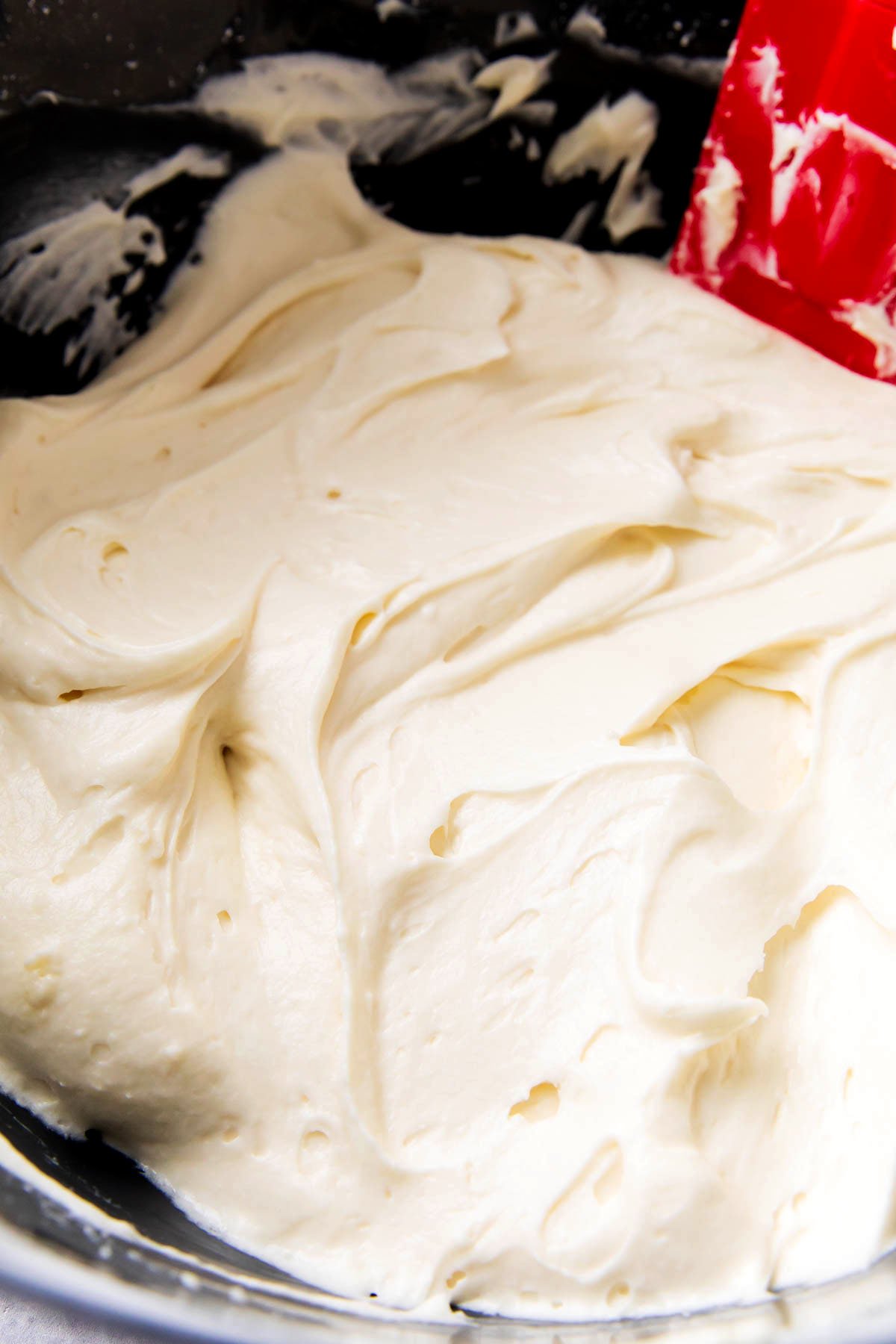 Cream cheese frosting in a mixing bowl.