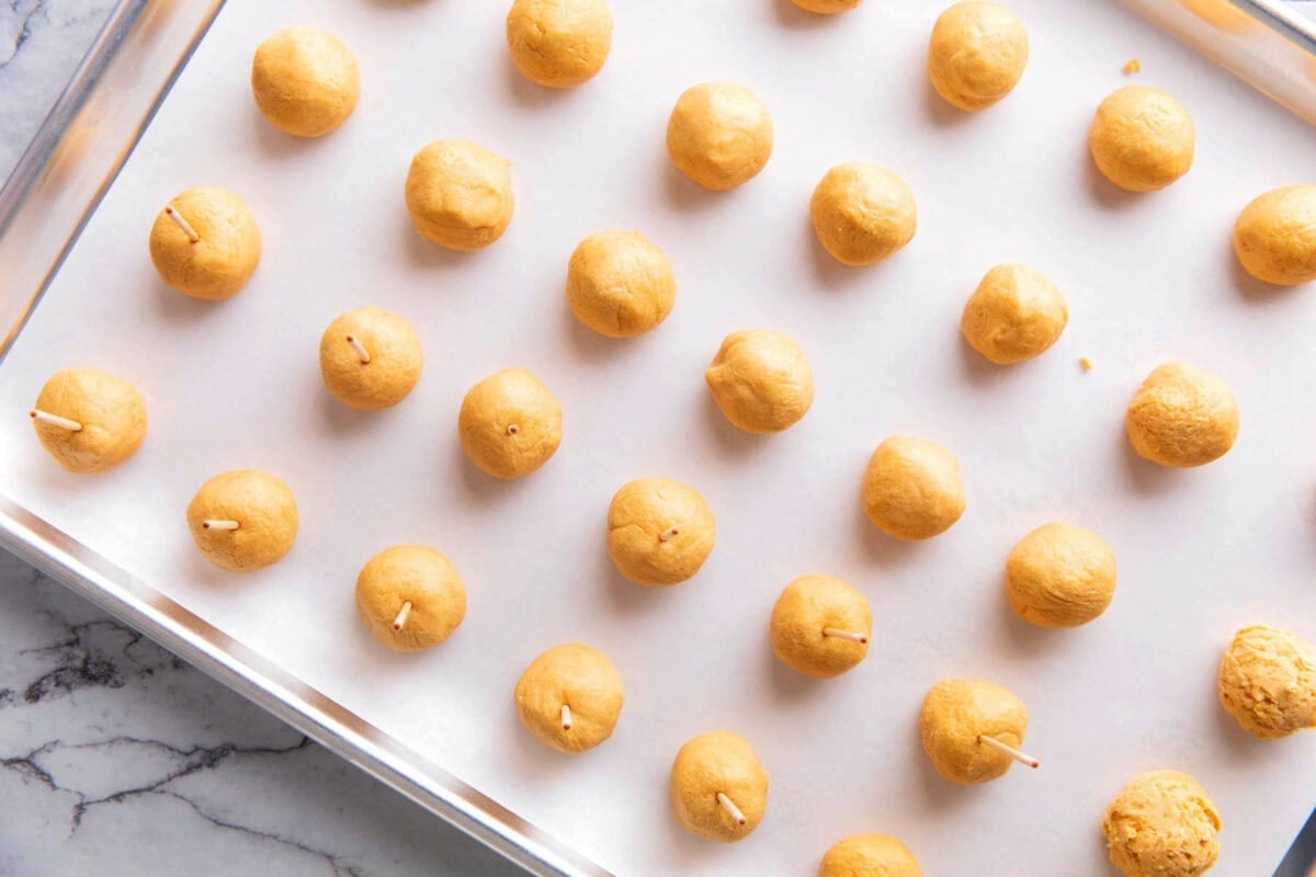 This creamy buckeye recipe includes rolling peanut butter balls as shown.