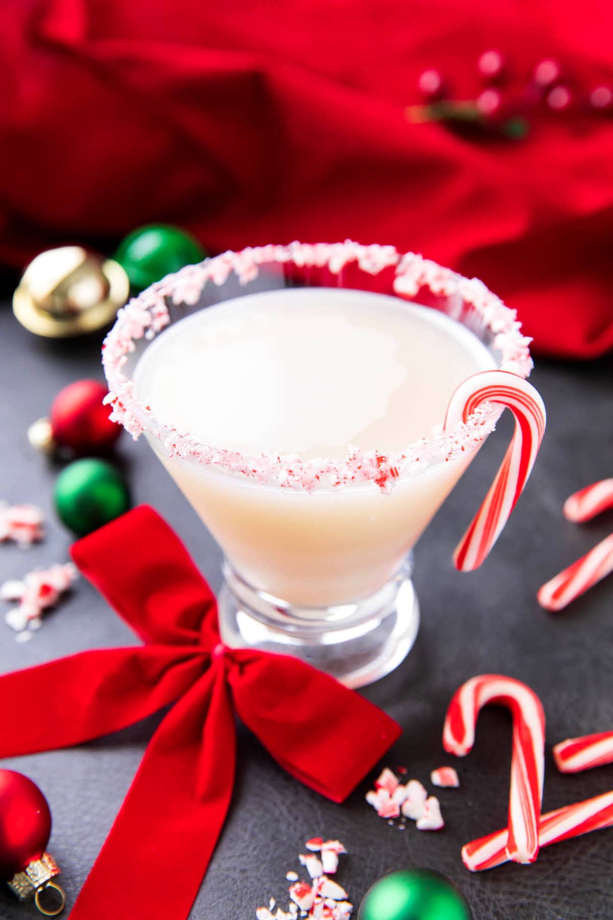 Candy Cane Martini served in a martini glass is sweet and made with creme de menthe and peppermint schnapps.