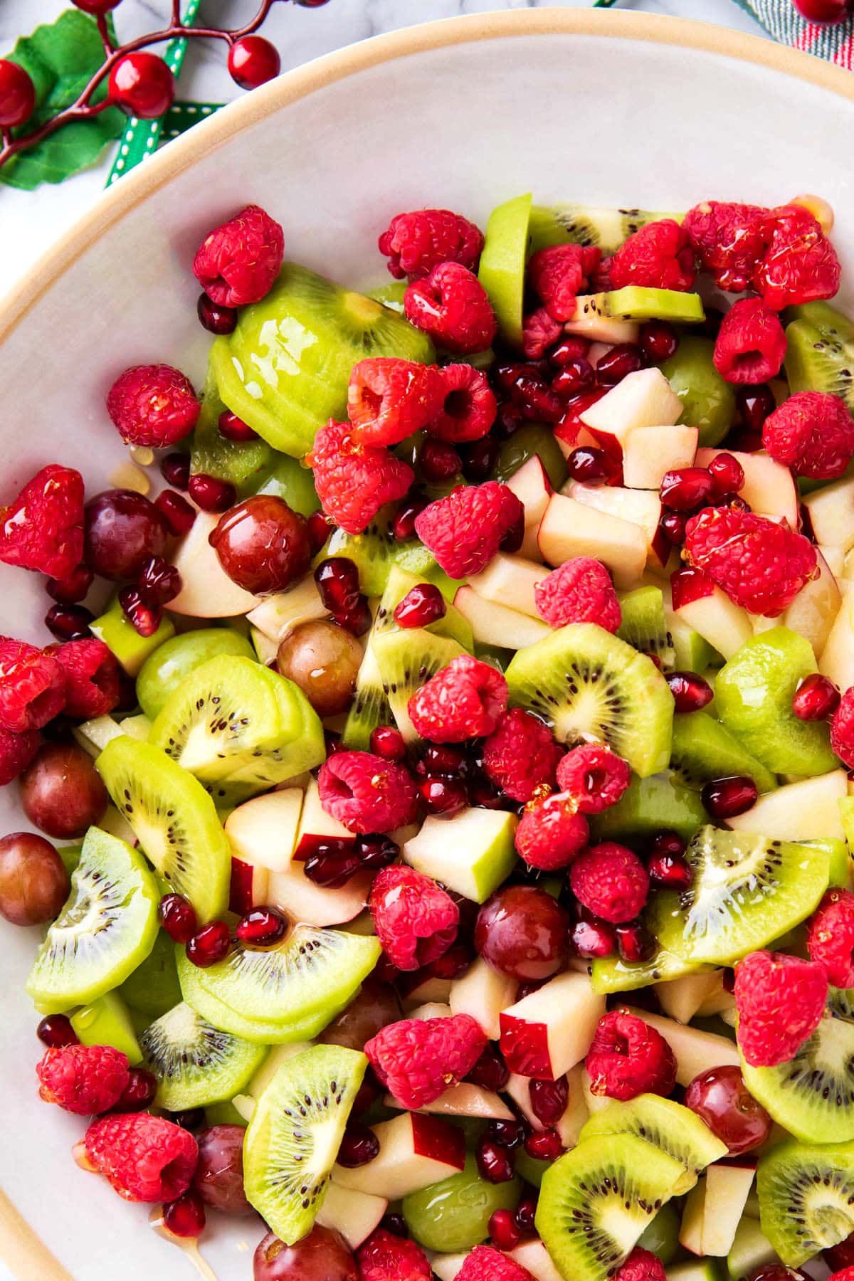 This fruit salad for Christmas brunch is packed with fresh fruit that is festively colored and a tangy sweet honey lime dressing.