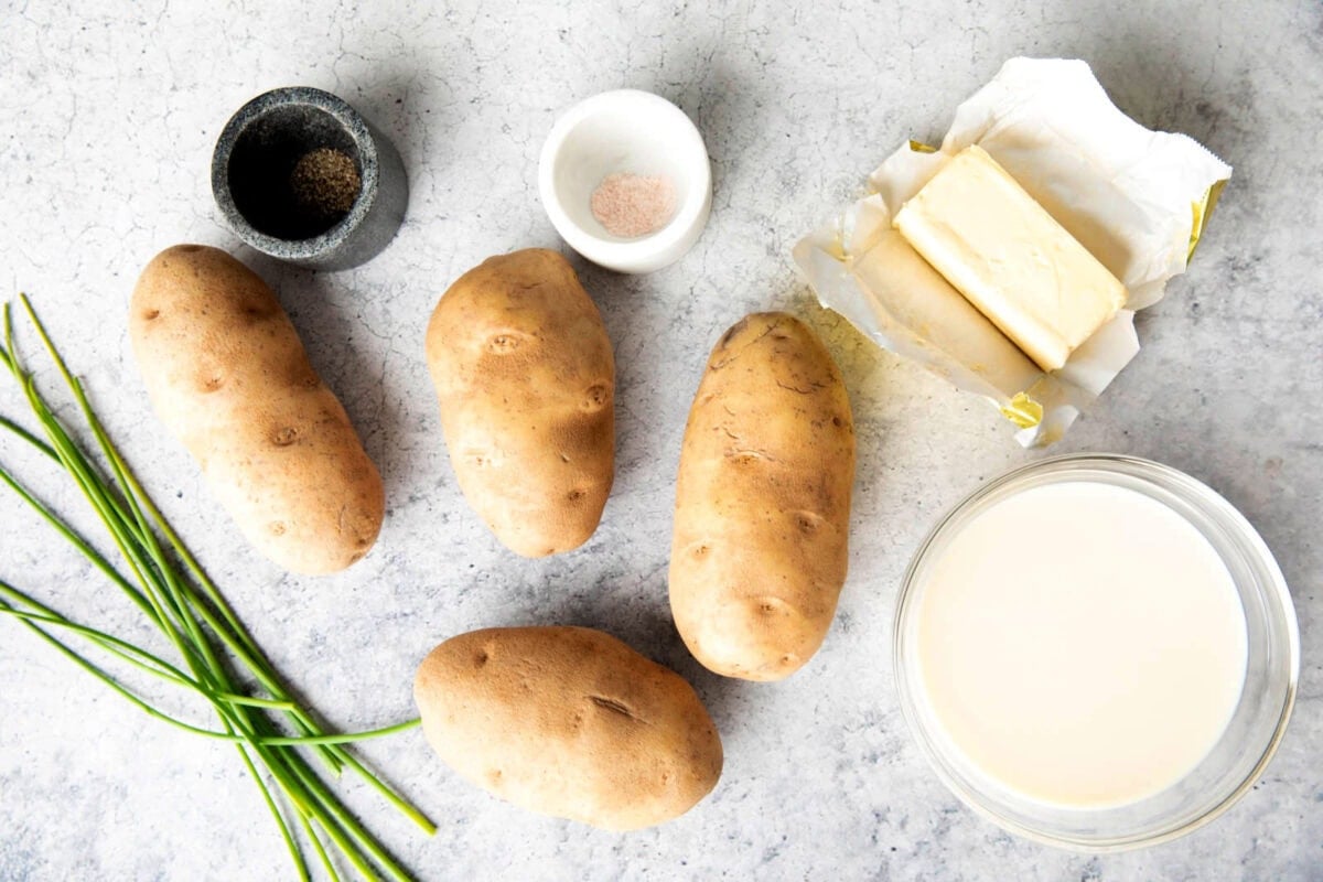 Quick and easy mashed potatoes recipe ingredients include potatoes, salt and pepper, butter, milk, and chives.