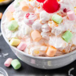Ambrosia Salad recipe with Cool Whip long Pinterest image.