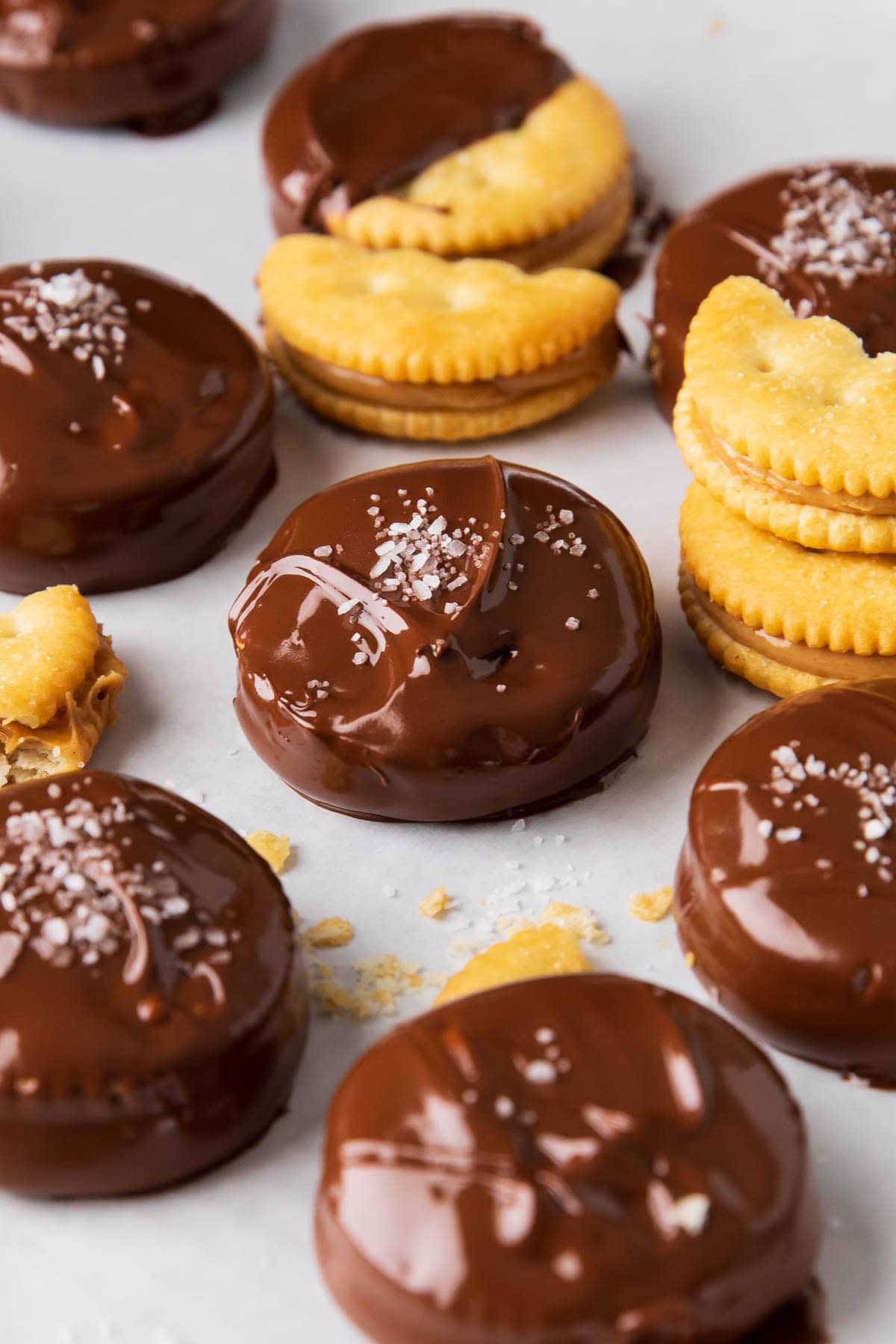 Chocolate Peanut Butter Ritz Cookies are dipped in chocolate and filled with peanut butter.