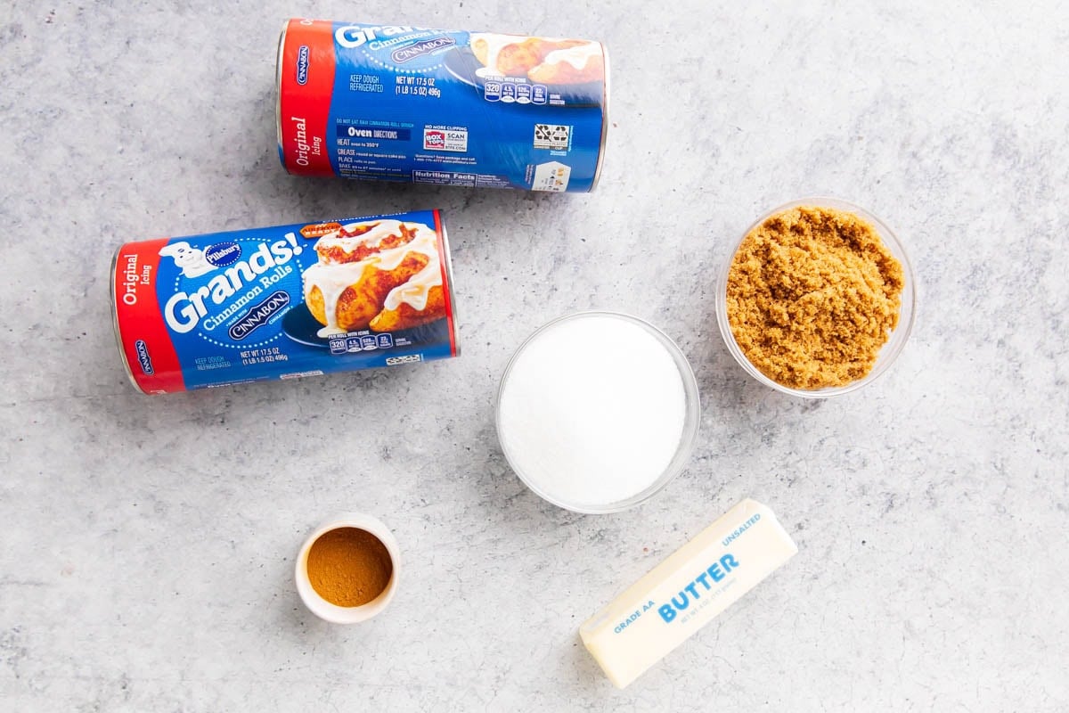 Cinnamon Roll Monkey Bread includes canned Pillsbury cinnamon rolls, brown sugar, cane sugar, cinnamon, and butter.