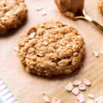 peanut butter oatmeal cookies with crisp edges and chewy oatmeal-packed centers on parchment paper