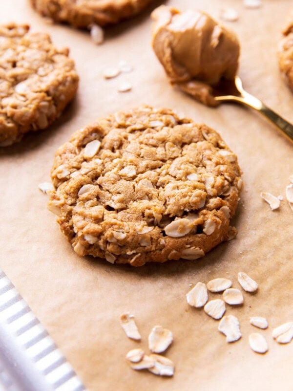 peanut butter oatmeal cookies with crisp edges and chewy oatmeal-packed centers on parchment paper