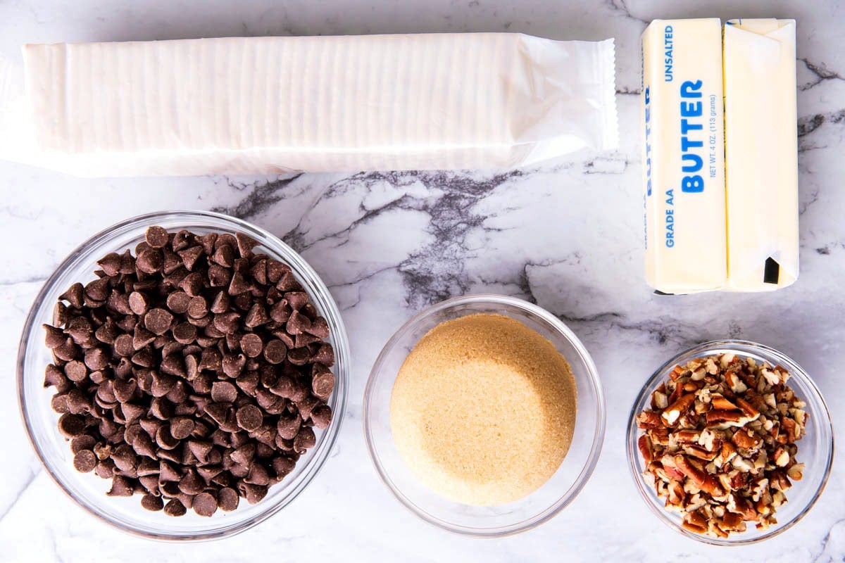 Saltine Cracker Toffee ingredients including saltine crackers, semisweet chocolate, brown sugar, butter, and pecans.