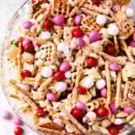 Valentine's Chex Mix is white candy coated Chex mix, cereal, pretzel and peanuts for a salty and sweet snack