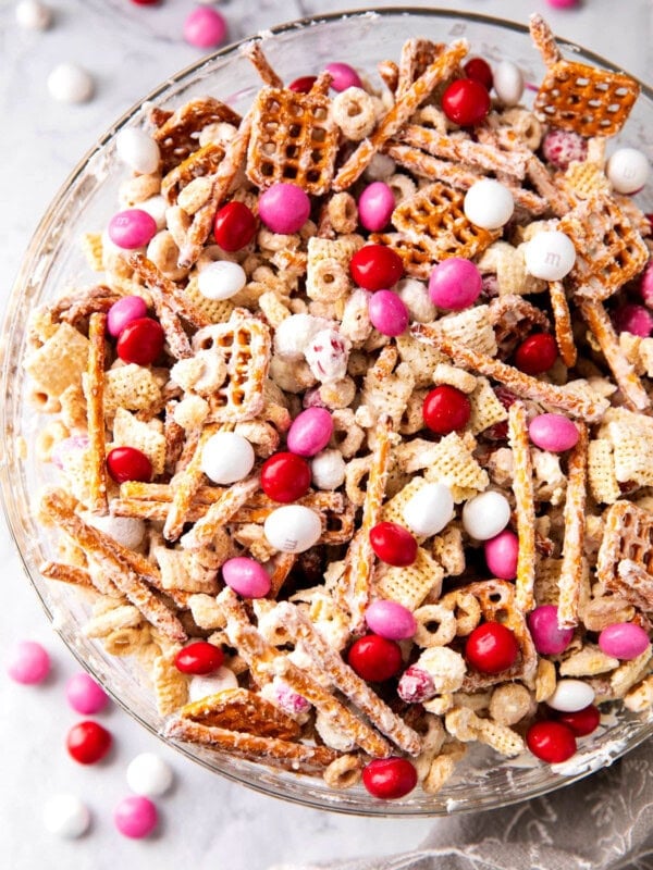 Valentine's Chex Mix is white candy coated Chex mix, cereal, pretzel and peanuts for a salty and sweet snack