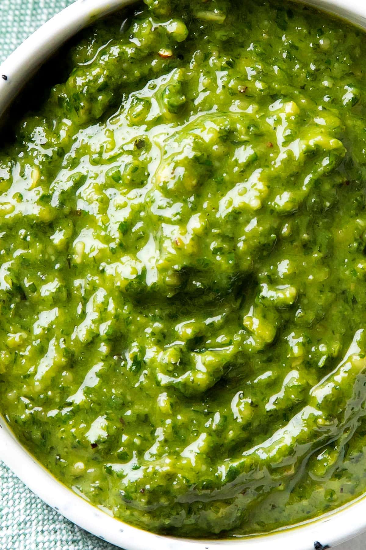 Close up of this homemade basil pesto sauce recipe to show the rich texture of perfect easy pesto sauce.