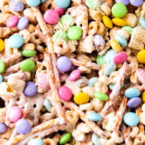 Close up of bunny bait shows white chocolate coated Chex cereal, pretzels, and Easter M&M candies