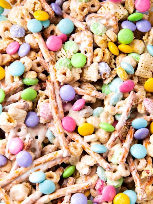 Close up of bunny bait shows white chocolate coated Chex cereal, pretzels, and Easter M&M candies