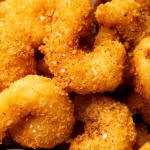 Fried crispy shrimp is coated in an easy bread crumb exterior that's crunchy and served with sauce
