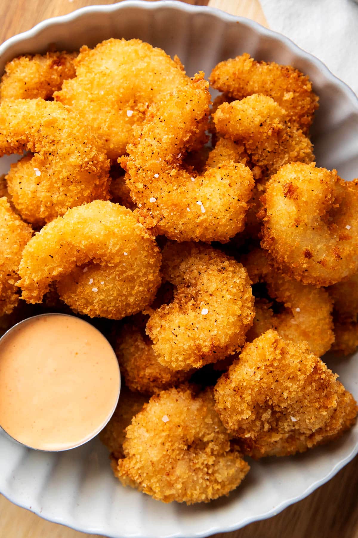 This crispy shrimp recipe is served with a creamy sauce to create flavor balance.