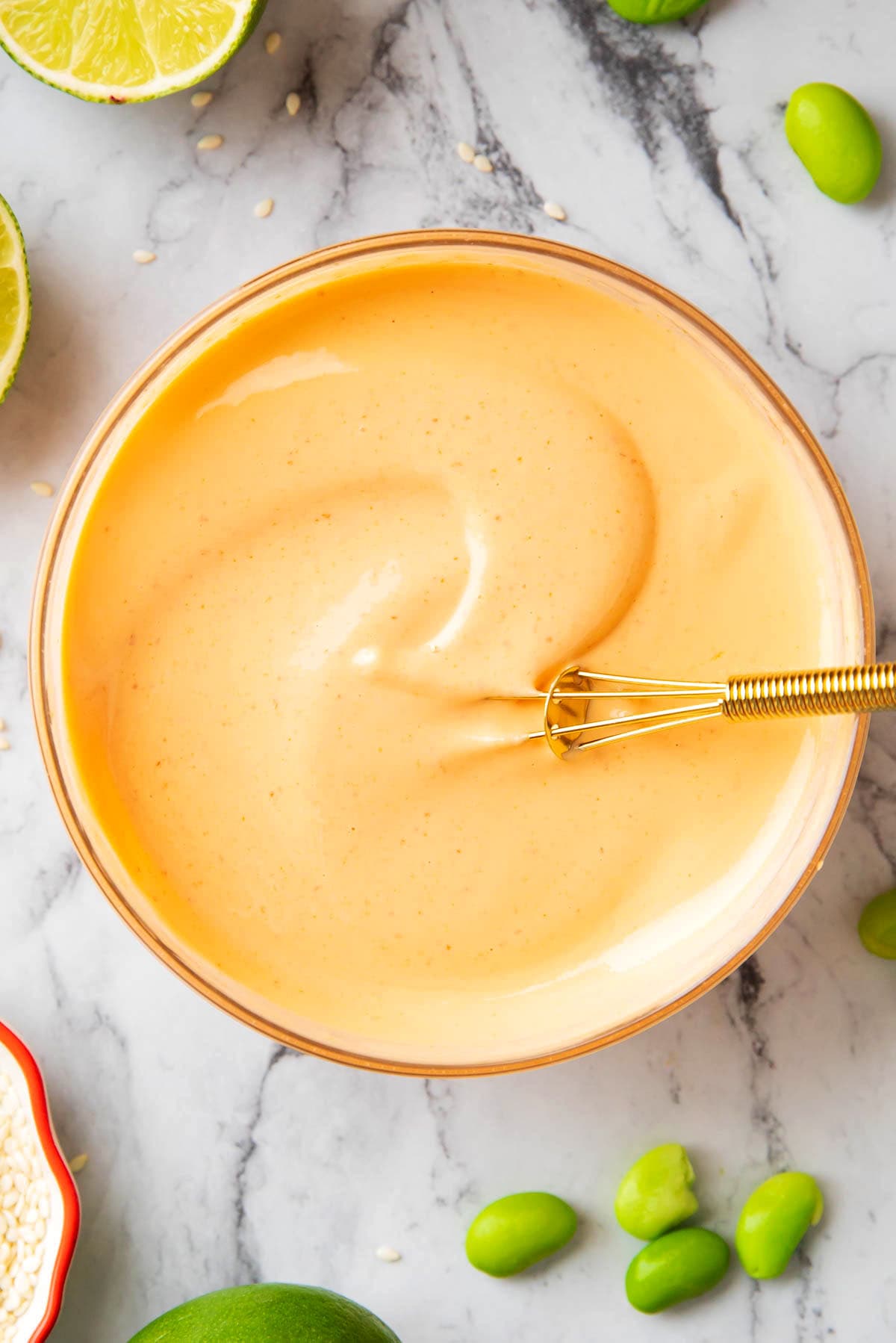 A closeup of spicy Kewpie mayo to show the spicy, creamy and thick texture that's perfect for serving with sushi.