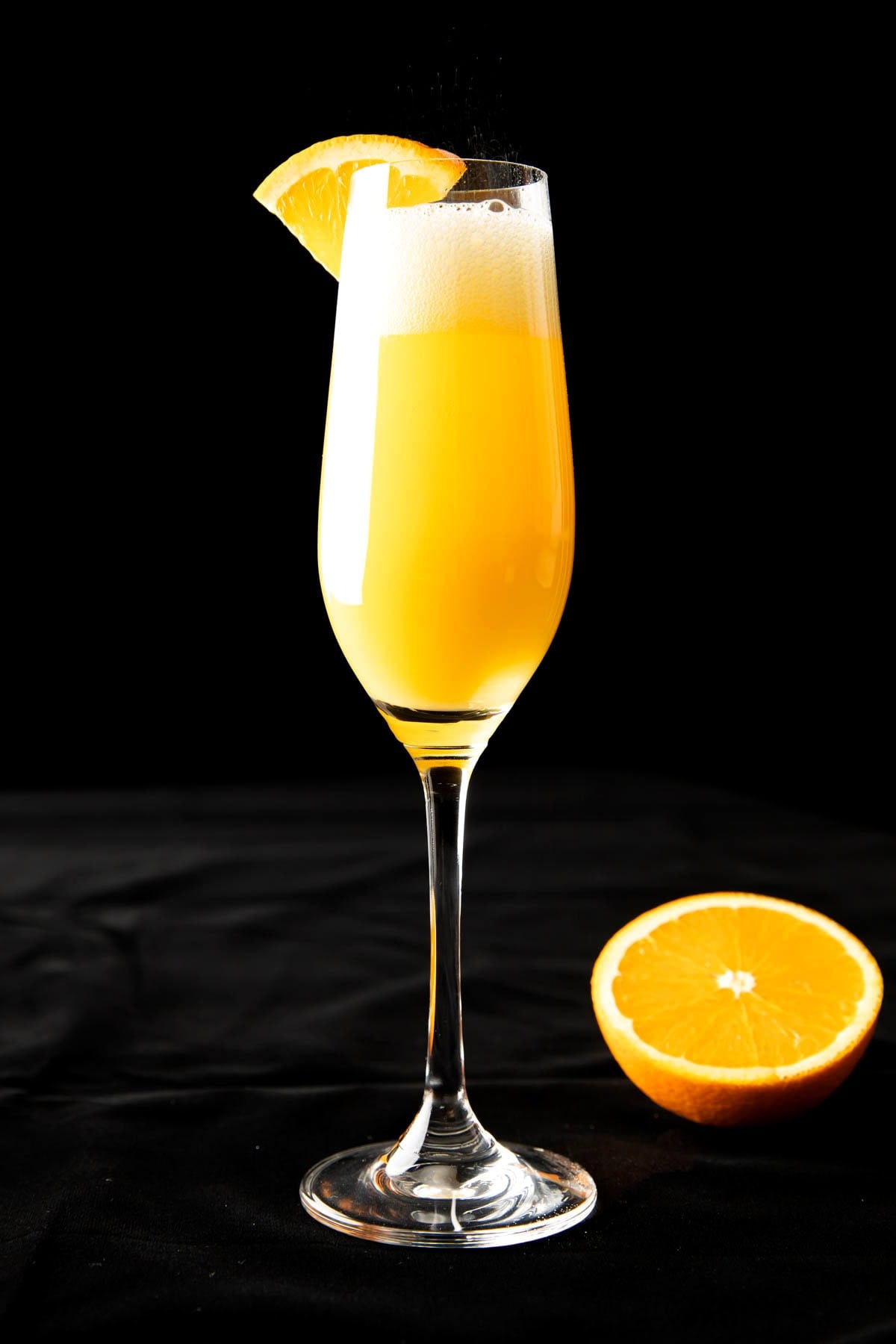 Mimosa recipe topped with Champagne served with fresh orange juice.